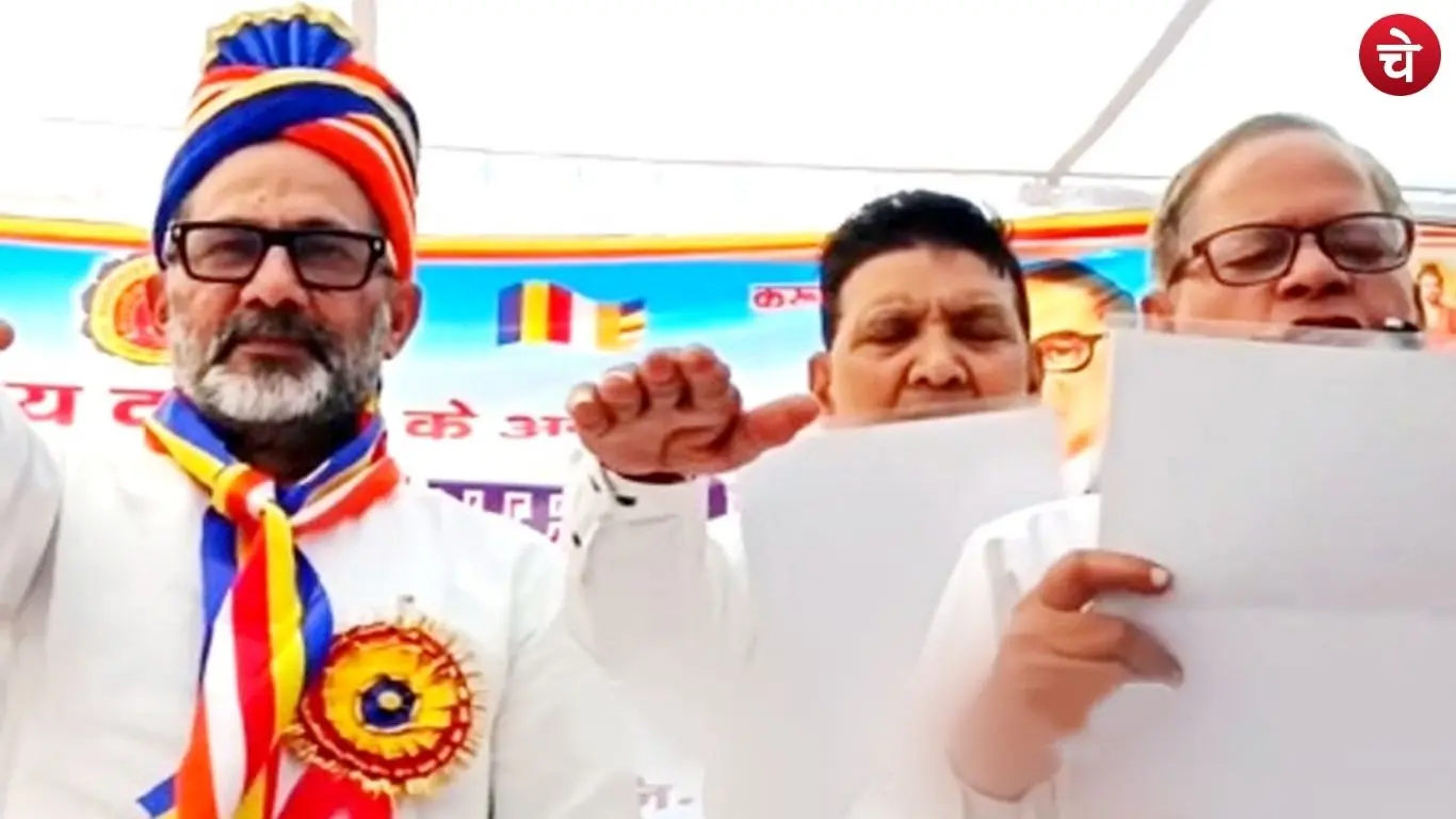 SP spokesperson Rajkumar Bhati taking an oath on stage at an event organized by the Bharatiya Bauddh Sabha
